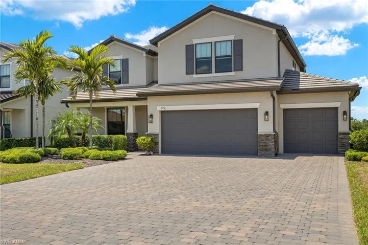 View of front of property with a garage