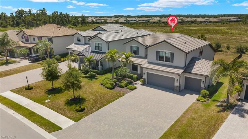 View of front of property with a garage and a front yard