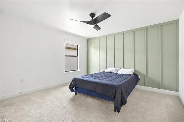 Bedroom with carpet flooring and ceiling fan
