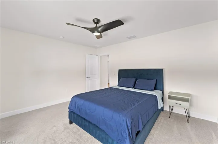 Bedroom with carpet floors and ceiling fan