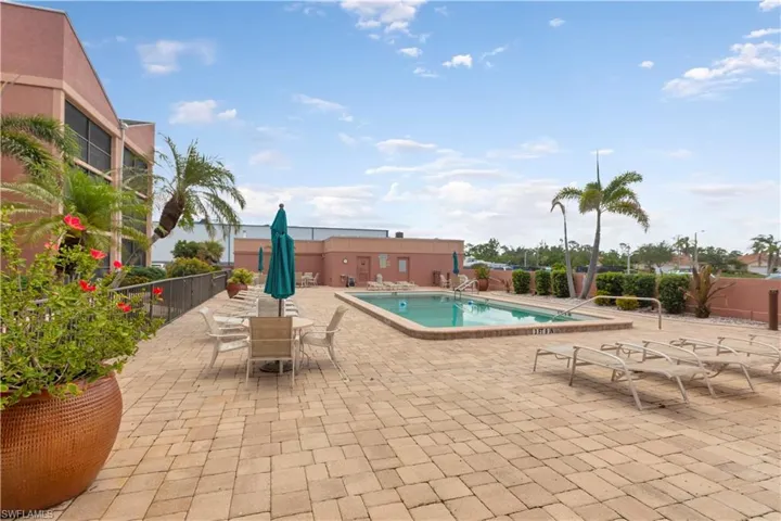 Community pool featuring a patio