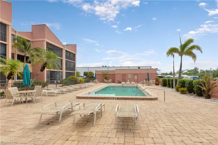 Community pool featuring a patio