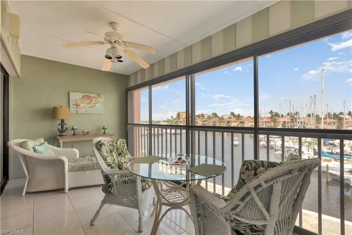 Sunroom / Lanai with a water view