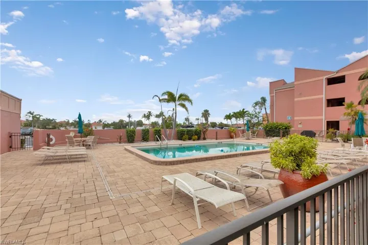 Community pool featuring a patio