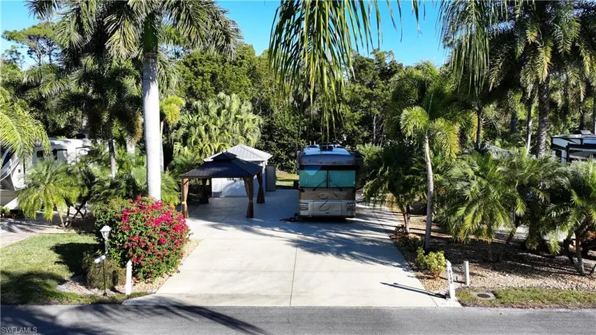 View of home's community featuring a gazebo, a patio, and a carport