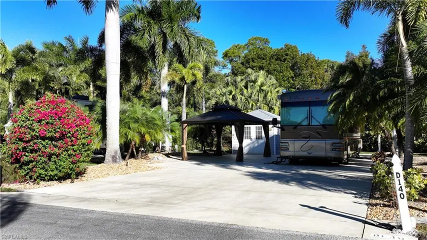 View of community featuring a gazebo and concrete driveway