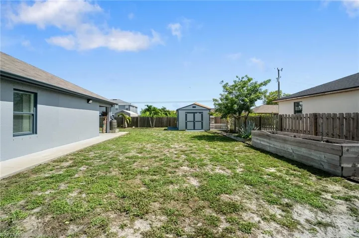 View of yard featuring a storage shed