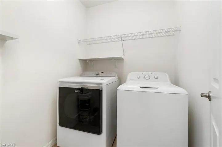 Large laundry room with washer and dryer.