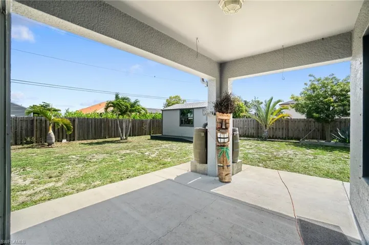 View of patio / terrace with a shed