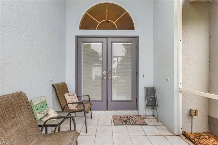 Property entrance featuring French doors