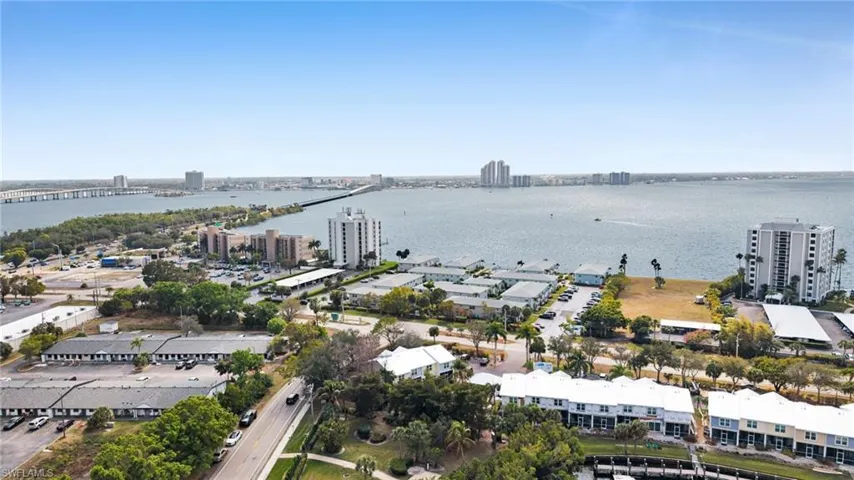 View of urban area with a large body of water and a notable bridge