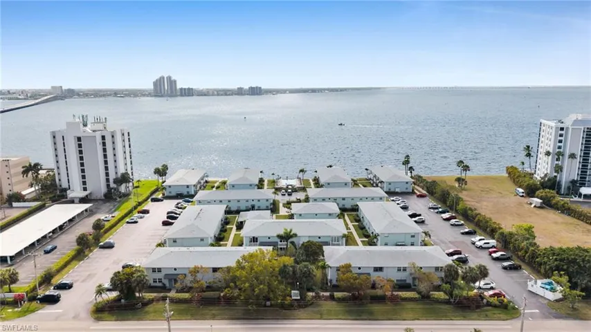 Bird's eye view of a large body of water and apartment complex