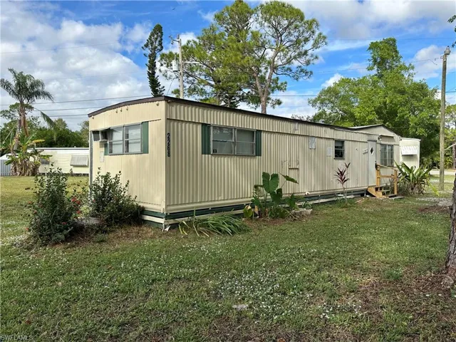 View of home's exterior with a yard
