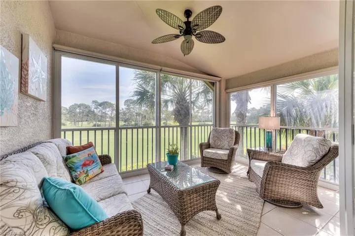 Sunroom featuring lofted ceiling and ceiling fan