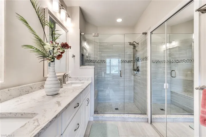 Bathroom featuring vanity and walk in shower