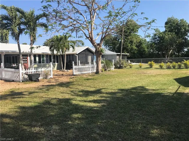Back of structure with large back yard