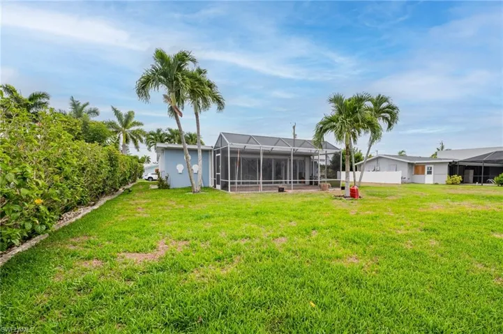 View of yard with a lanai