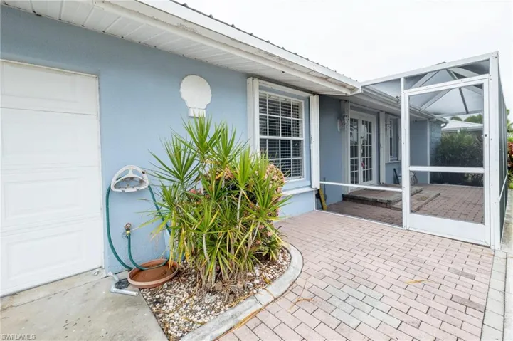 View of patio featuring a garage