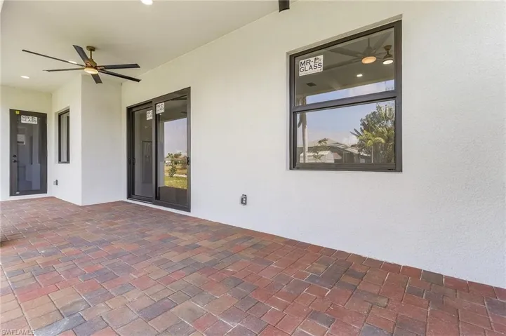 View of patio featuring ceiling fan