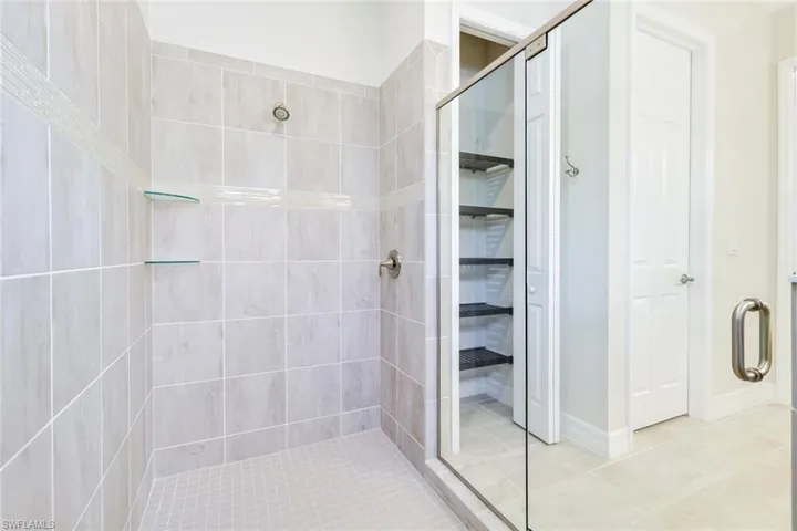Bathroom with a shower with shower door