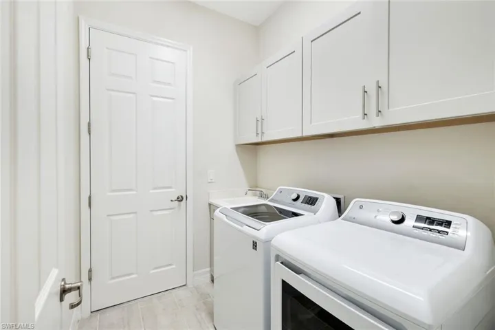 Laundry room features a laundry/wash tub