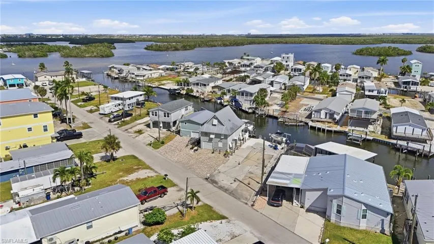 Aerial perspective of suburban area with a nearby body of water