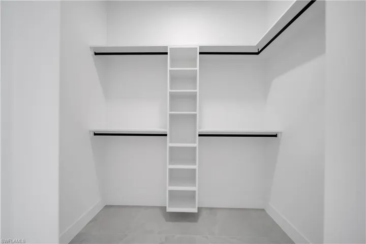 Spacious closet with marble finish flooring