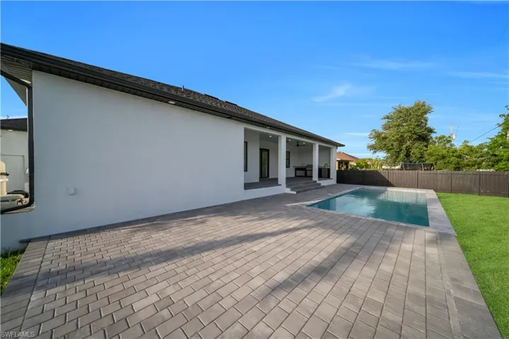 View of pool with a patio area and a fenced backyard