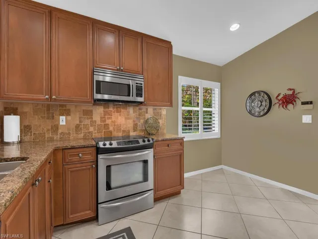 Kitchen with stainless steel appliances and wood cabinets