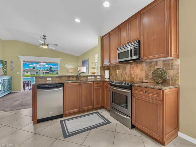 Kitchen open to Family Room and lake view