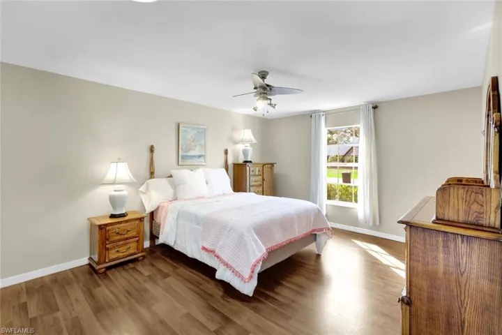 Bedroom featuring hardwood / wood-style floors and ceiling fan