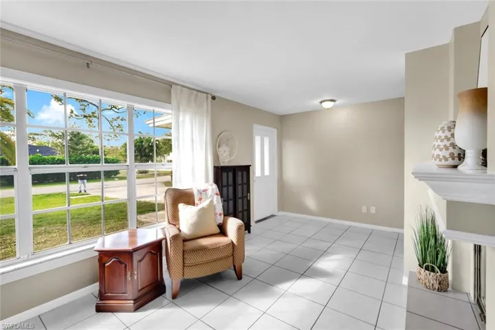 Living area featuring plenty of natural light and light tile patterned floors