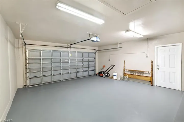 Garage featuring a garage door opener