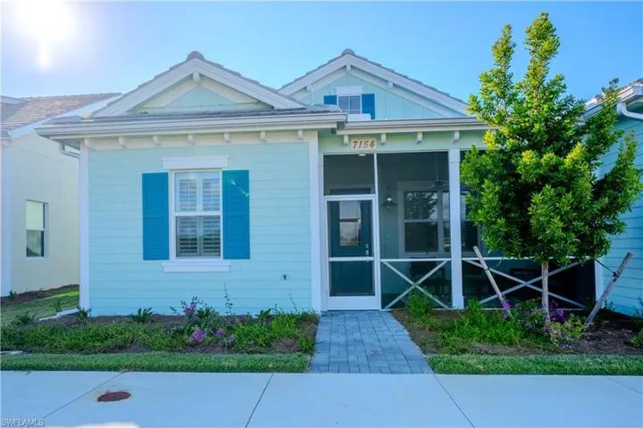 View of front of house featuring a sunroom