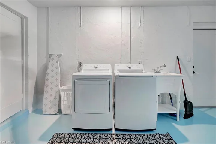 Laundry room featuring washer and clothes dryer