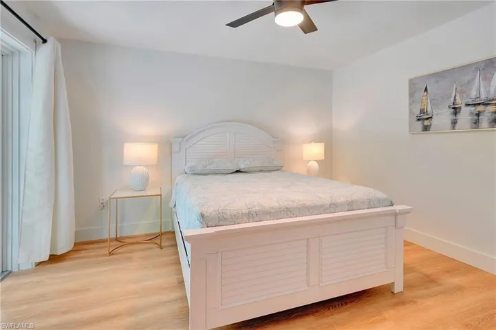 Bedroom featuring hardwood / wood-style flooring and ceiling fan