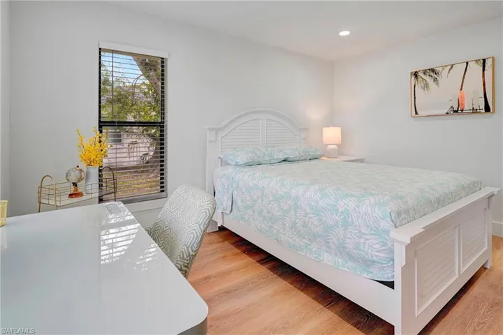 Bedroom with light hardwood / wood-style floors