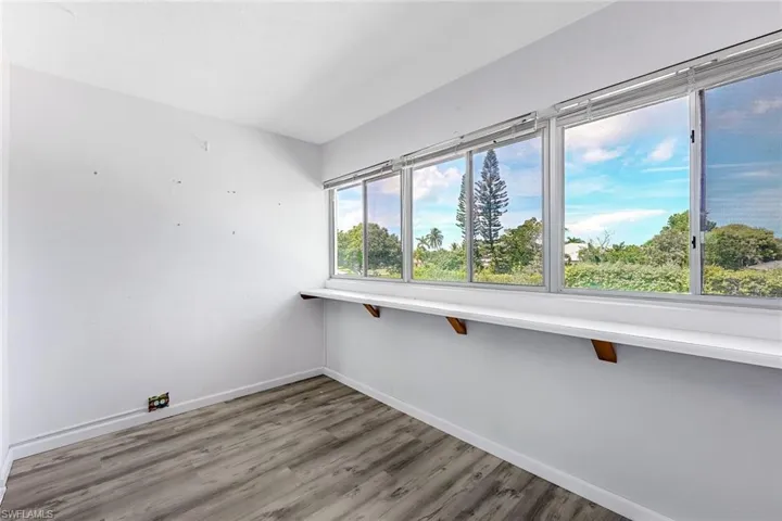 Spare room with hardwood / wood-style flooring