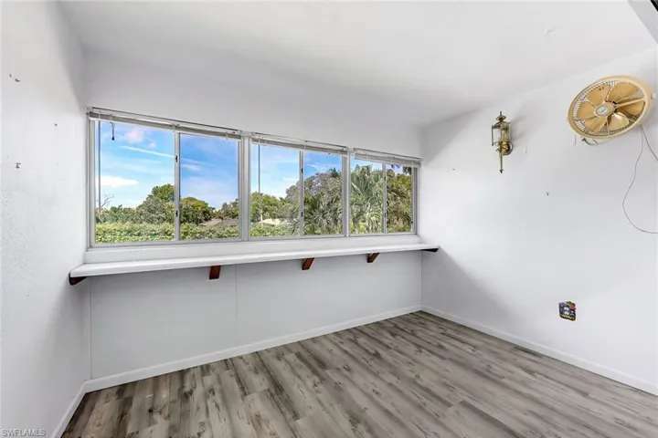 Empty room with wood-type flooring