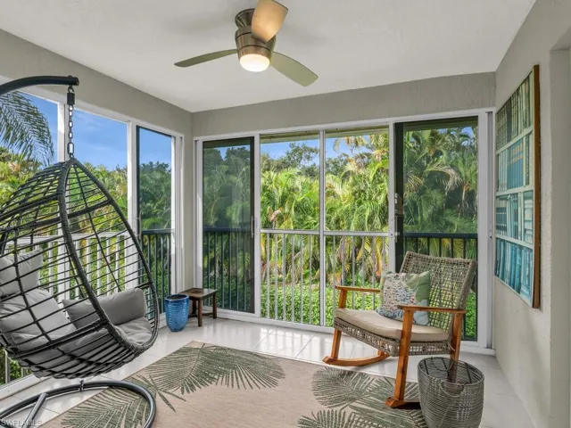 Sunroom featuring ceiling fan