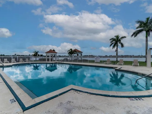 View of swimming pool with a water view
