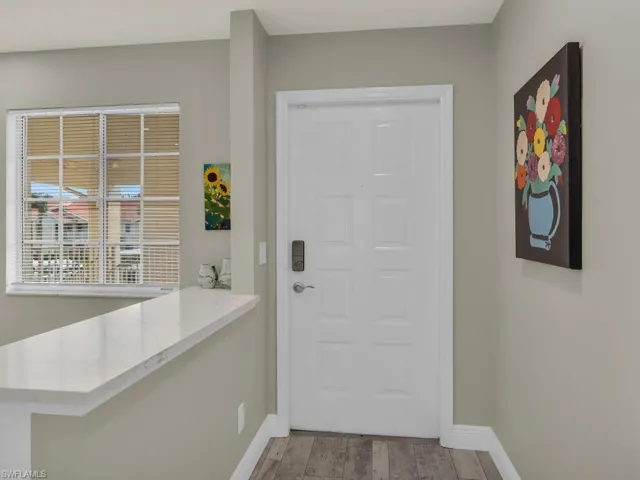 Foyer with light hardwood / wood-style floors