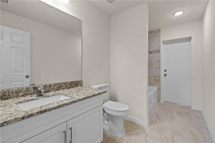 Guest bath exits to screened lanai
