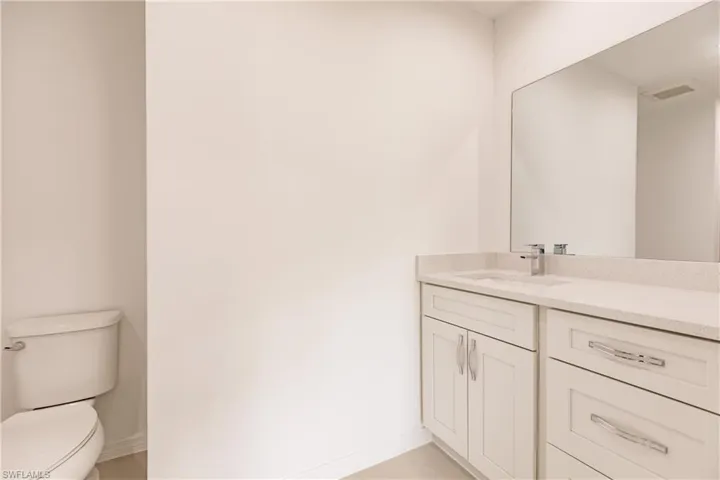 Bathroom with toilet and vanity