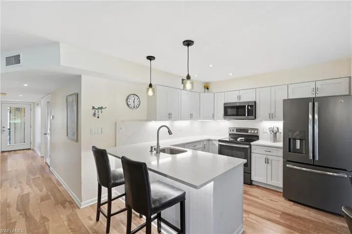 UPDATED CONTEMPORARY KITCHEN - SLEEK QUARTZ COUNTERS...