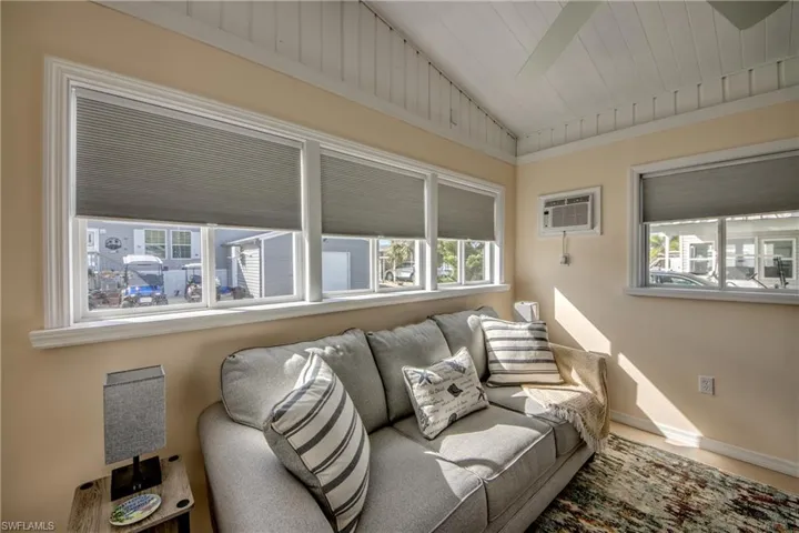 Living room featuring a wall mounted AC