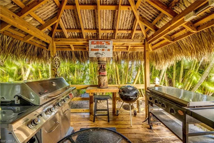 View of patio featuring an outdoor kitchen, area for grilling, and a gazebo