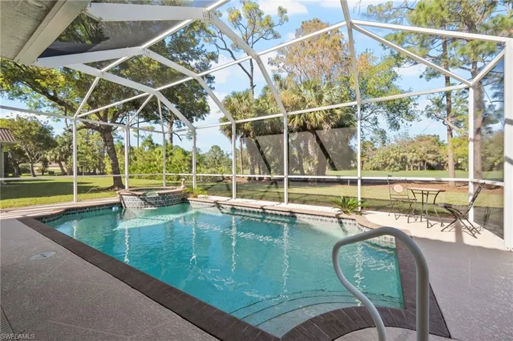 View of pool with a lawn, a lanai, and a patio