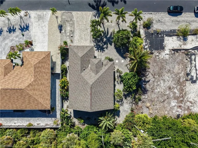 aerial of house and vacant lot next door