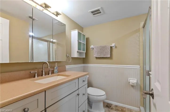Master Bathroom with updated vanity and wainscotting
